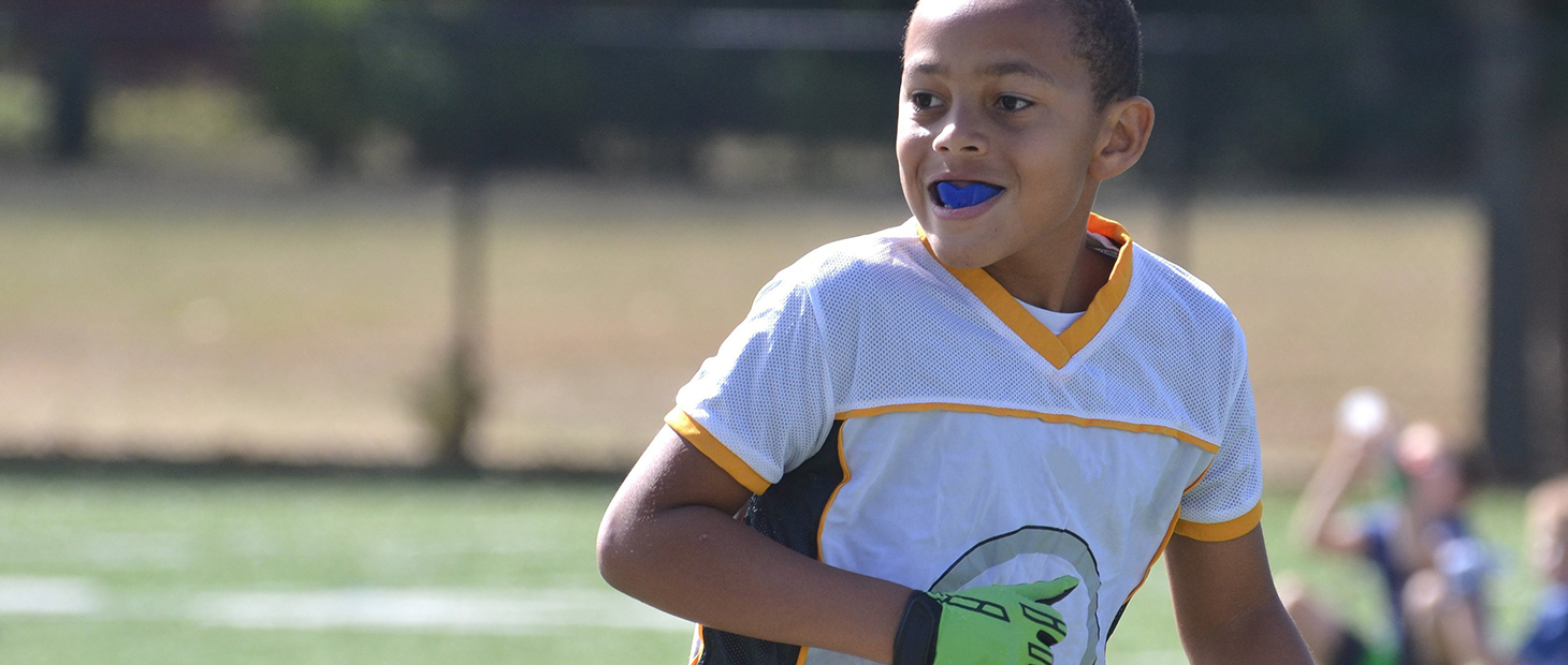 Youth athlete with mouthguard