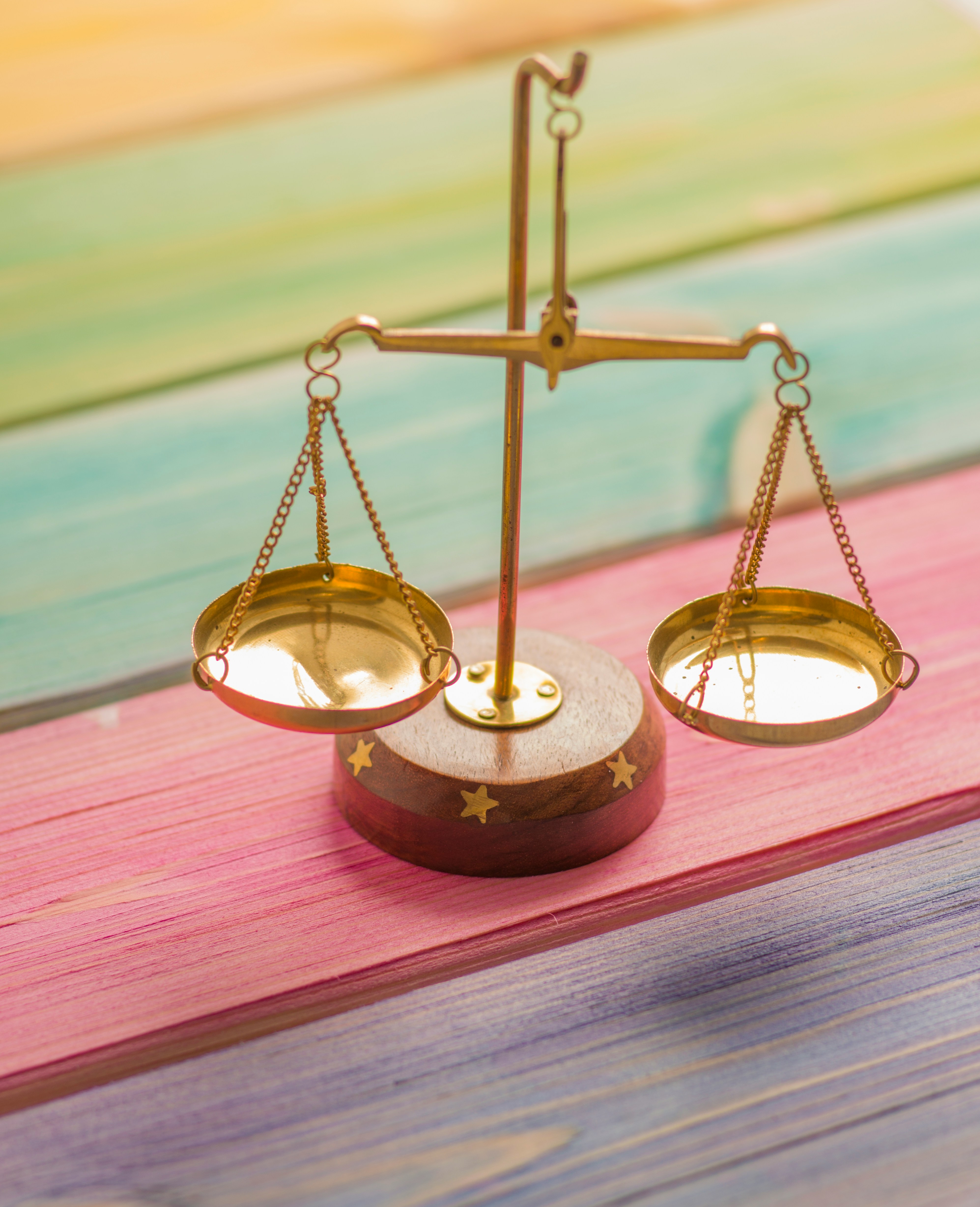 justice scale on a colorful table