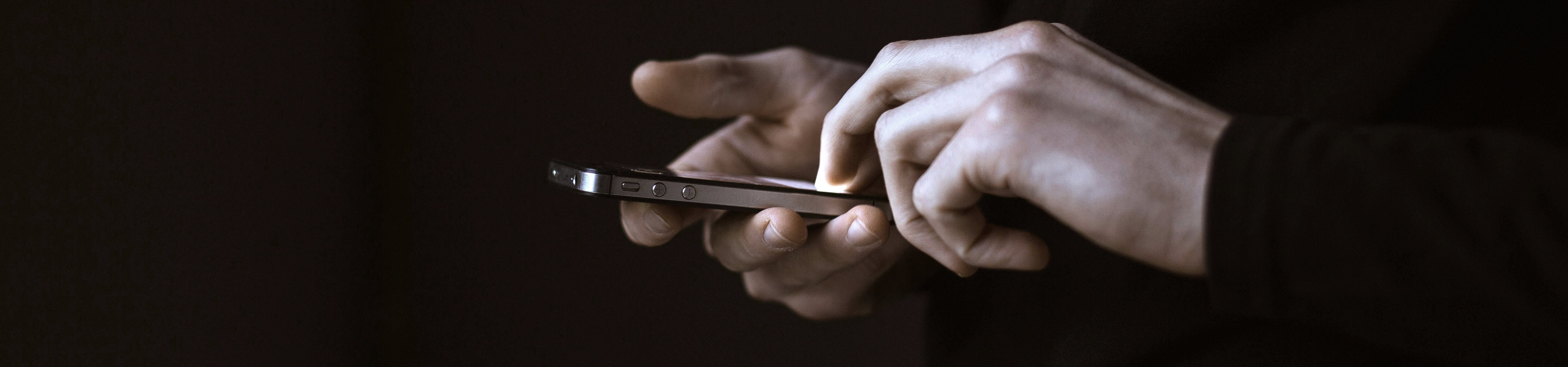 phones holding a mobile phone